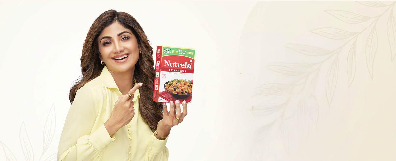 Shilpa Shetty holding a pack of Nutrela Soya Chunks